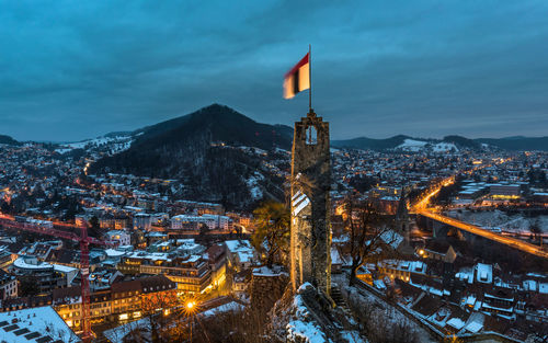 High angle view of illuminated buildings in city during winter