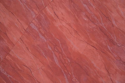 Full frame shot of rock wall marble marmor paint wallpaper background red