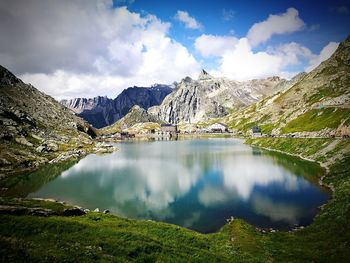 Scenic view of lake and mountains against sky