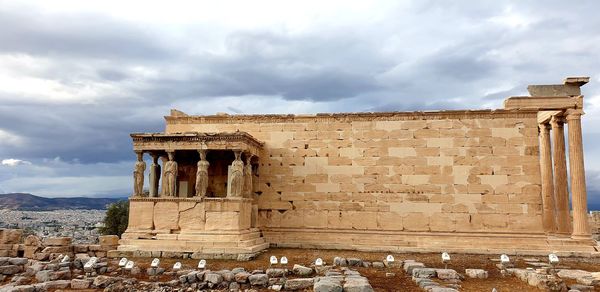 Old ruins of temple against cloudy sky