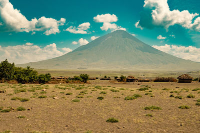 View of masai village at mount ol doinyo lengai in ngorongoro conservation area, tanzania