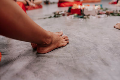 Low section of woman on hardwood floor