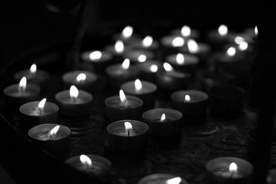 Close-up of illuminated tea lights