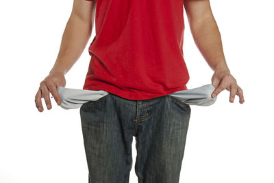 Midsection of man standing against white background