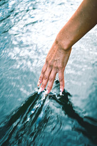 Man splashing water in sea