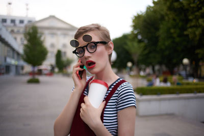 Portrait of beautiful young woman in bubbles