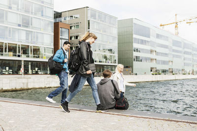 Young friends on stairway by river