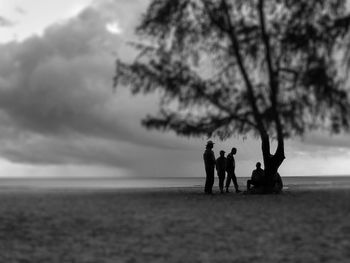 Silhouette of people on beach