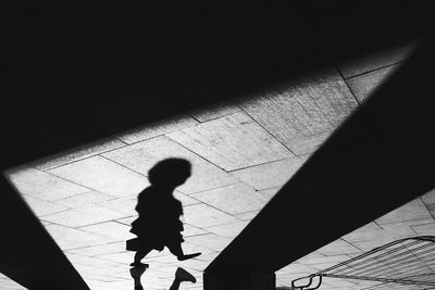 Shadow of person walking on floor
