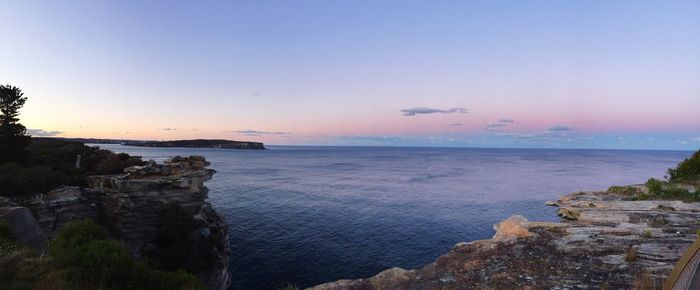 Scenic view of sea against blue sky