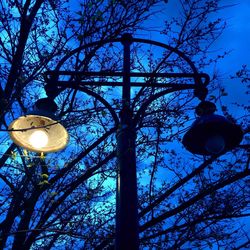 Low angle view of lamp post against sky