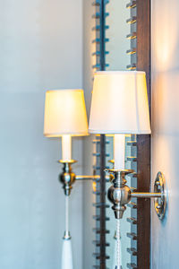 Close-up of electric lamp on wall