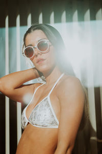 Portrait of young woman wearing sunglasses