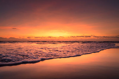 Scenic view of sea against romantic sky at sunset
