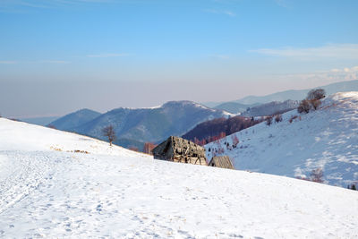 Sun over the winter mountains with snow, cindrel mountains, paltinis, romania