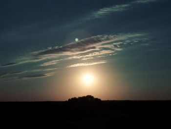 Scenic view of silhouette landscape against sky at sunset