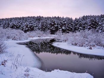 Scenic view of frozen lake against sky