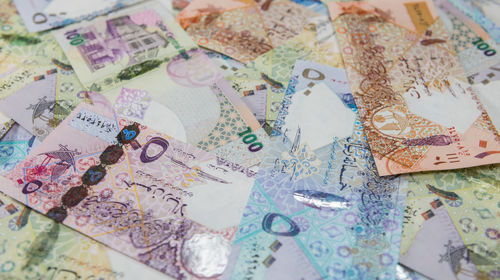High angle view of qatar currencies