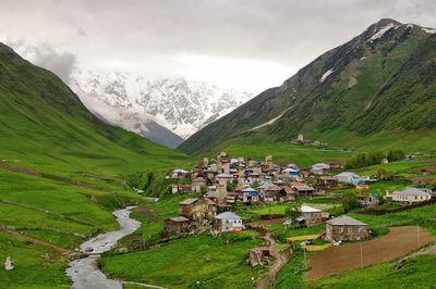 Scenic view of mountains against cloudy sky