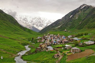 High angle view of village against mountains