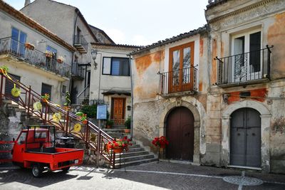 A narrow street between the old houses of marsicovetere, a village  of potenza province, italy.