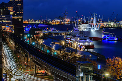 High angle view of illuminated buildings in city at night