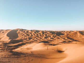 Scenic view of desert against clear sky