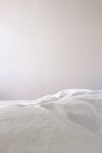 White bed sheet in bedroom