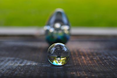 Close-up of crystal ball on table