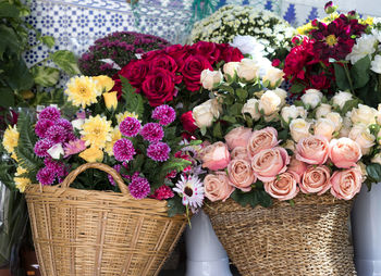 Close-up of multi colored flowers in basket