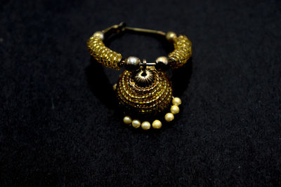 High angle view of gold colored pencils on table