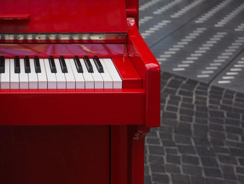 Red piano outdoors