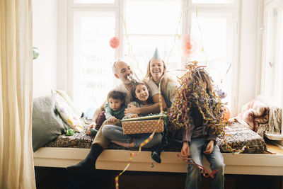 Happy family enjoying birthday party at home