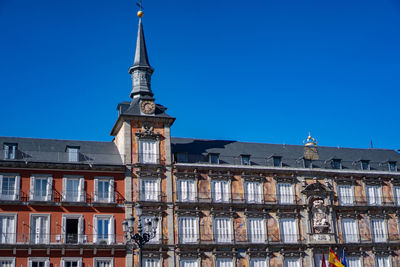 Low angle view of building against clear blue sky