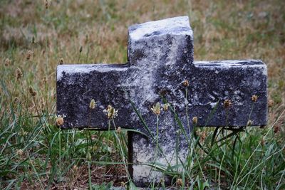 Close-up of cross on field