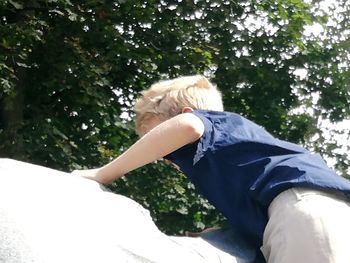 Low angle view of woman against plants