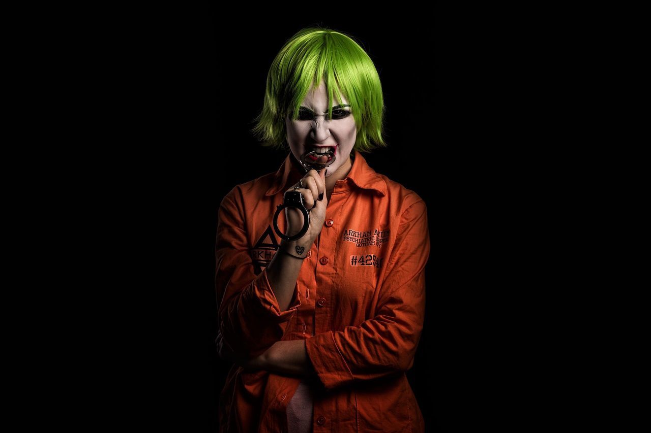 studio shot, black background, front view, one person, young adult, portrait, looking at camera, lifestyles, real people, night, dyed hair, young women, halloween, clown, indoors, blond hair, adults only, adult, people