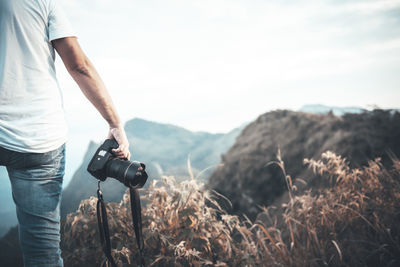 Full length of man standing on mountain road