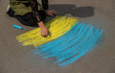 Midsection of woman standing on field