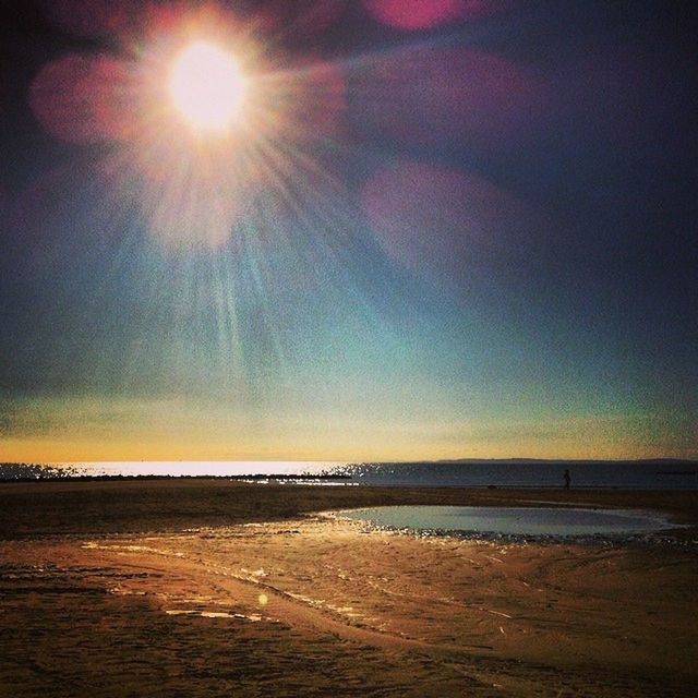 sea, horizon over water, water, beach, tranquil scene, sun, tranquility, scenics, sky, beauty in nature, sunset, shore, nature, idyllic, reflection, sunlight, sunbeam, sand, silhouette, cloud - sky