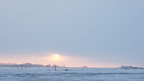 Scenic view of sea against clear sky during sunset