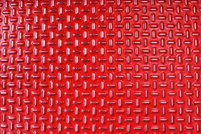 Full frame shot of red metal with pattern