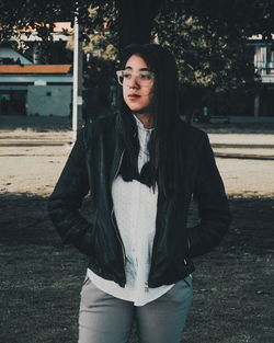 Portrait of young woman standing outdoors