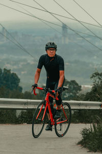 Man riding bicycle on street