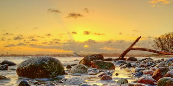 Scenic view of sea at sunset