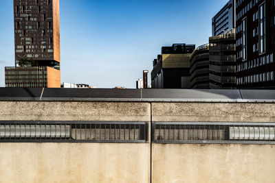 Low angle view of buildings against blue sky