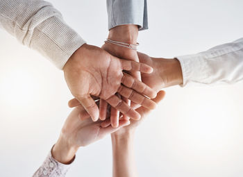 Cropped image of couple holding hands