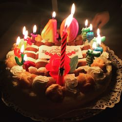 High angle view of cake with candles on table