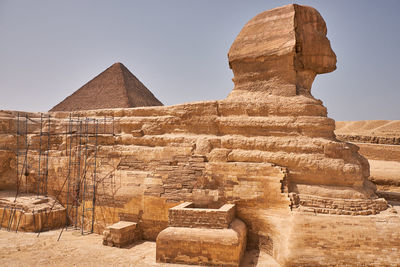 Ancient temple against sky