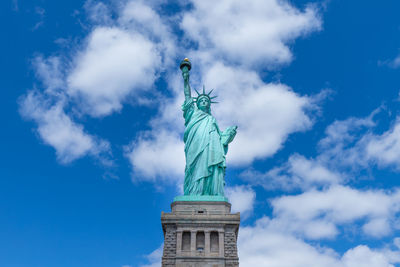 Low angle view of statue against cloudy sky